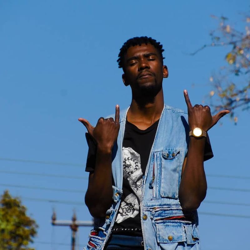 Hands up against a blue sky, 2019